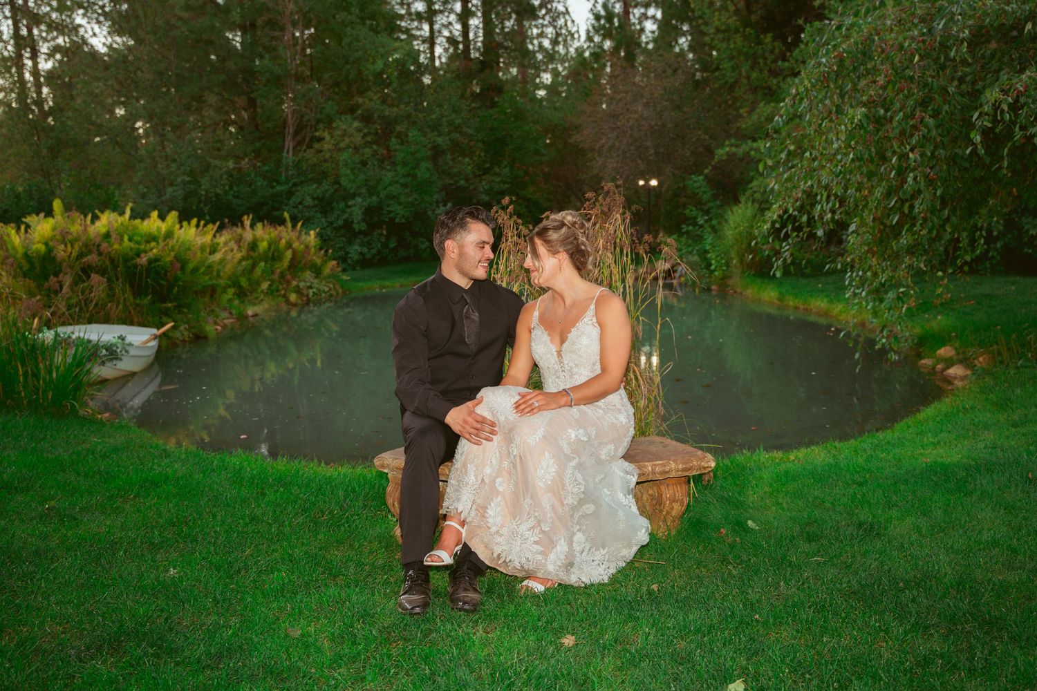 Series of romantic poses between couple on grassy hillside at sunset.