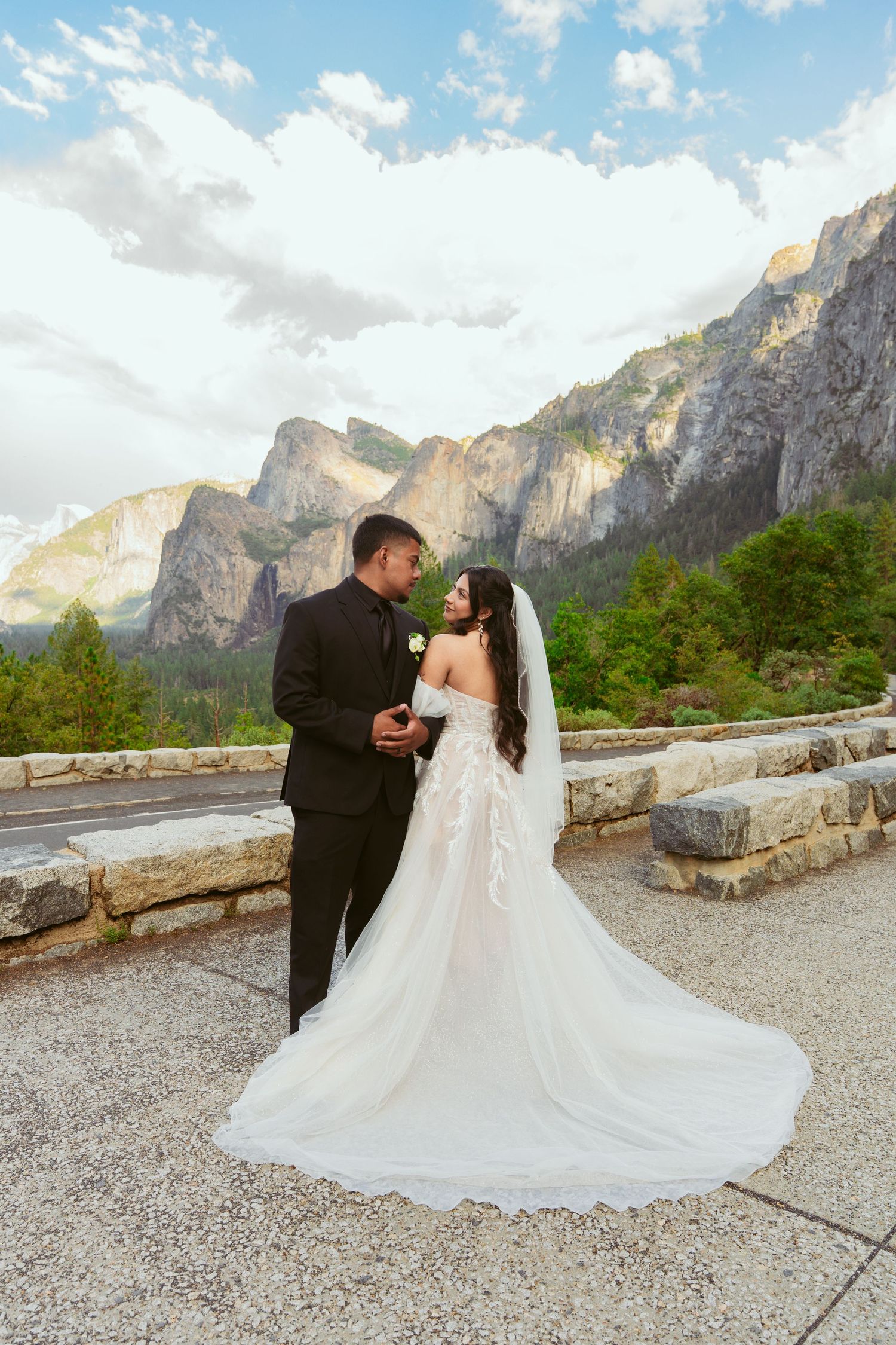 Wedding photography sequence showing couple's romantic interaction with Yosemite's majestic cliffs behind them.