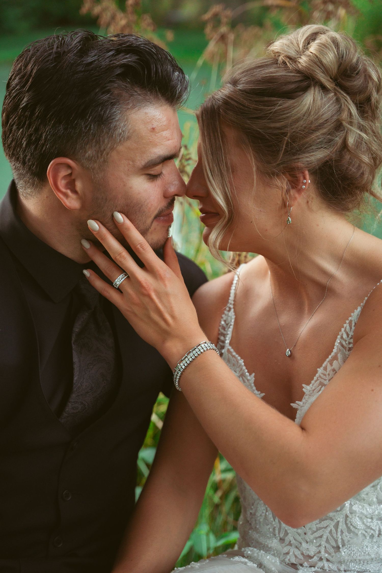 Romantic wedding portrait with silver jewelry details and lace dress.