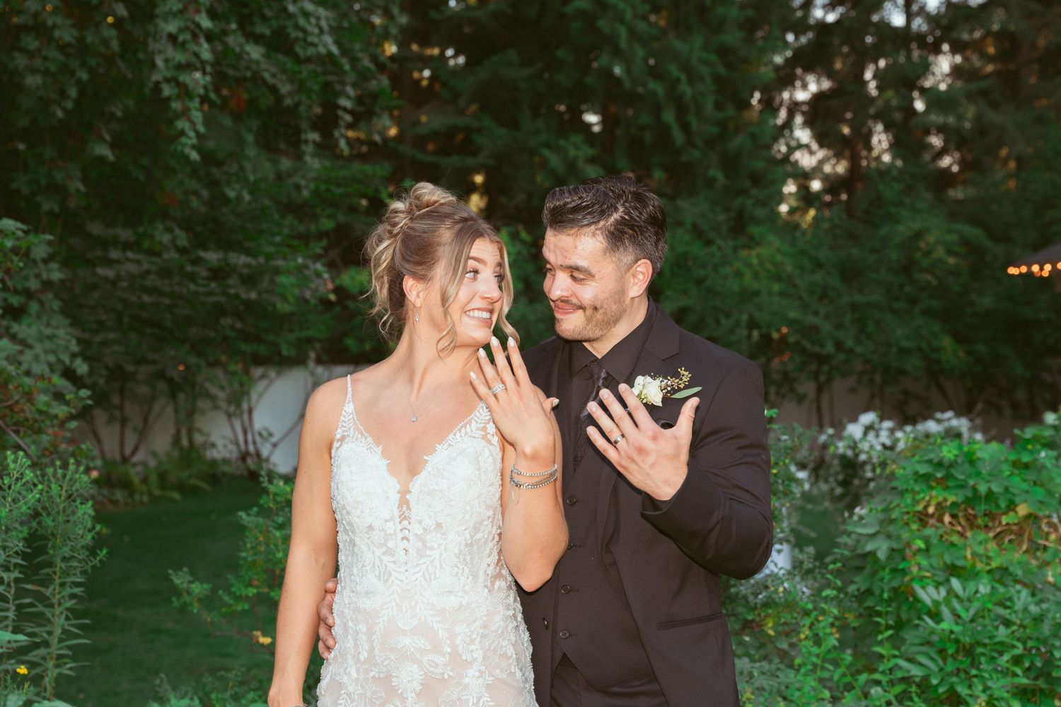 Romantic wedding photoshoot in a garden setting with natural lighting.