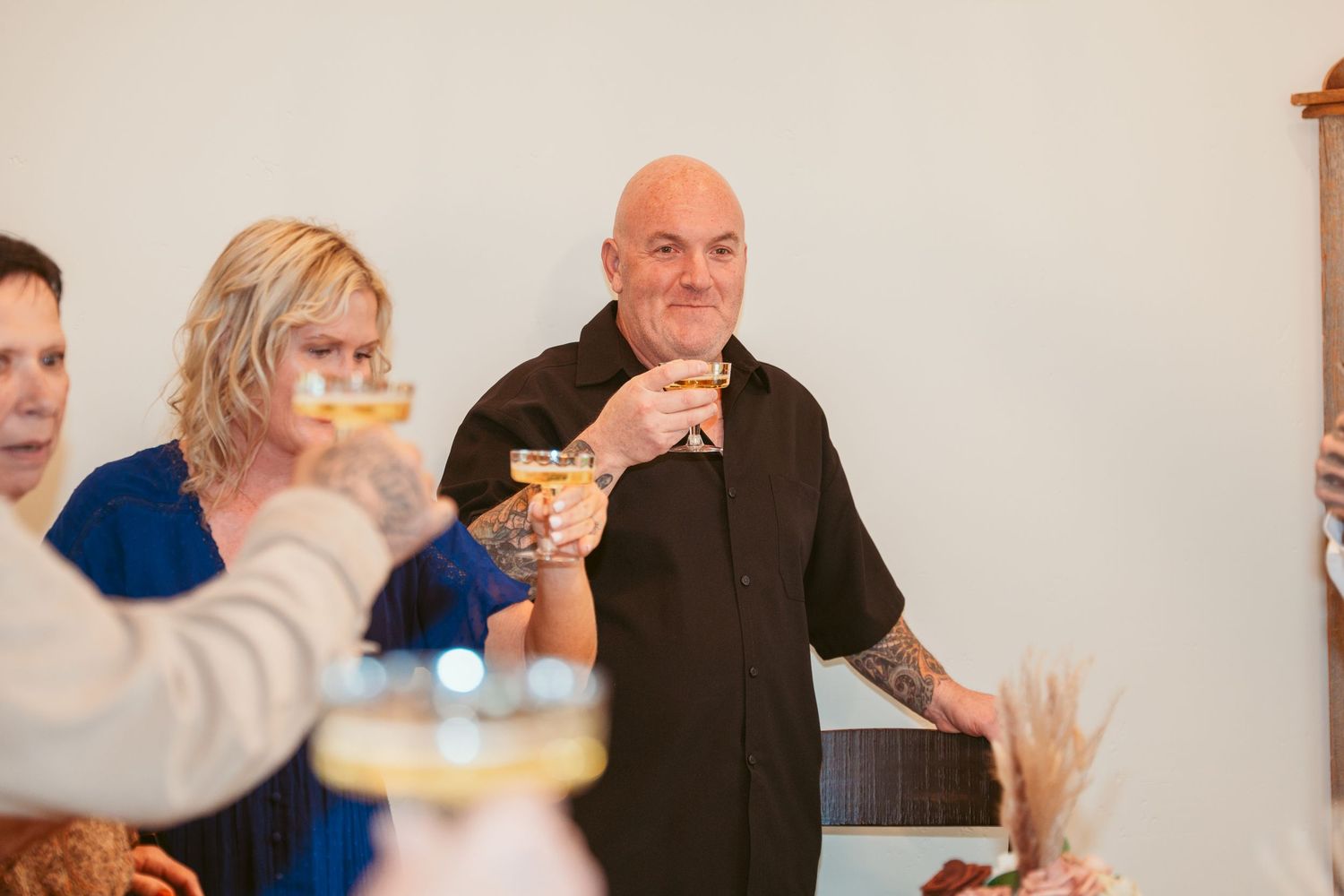 Guests enjoy drinks and conversation during a wedding celebration.
