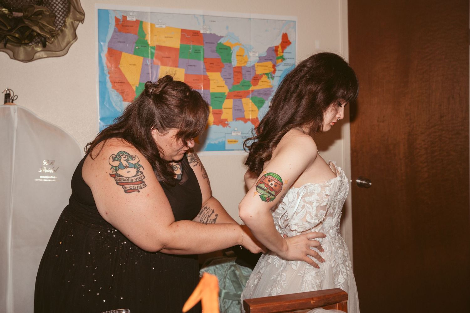 Wedding preparation scene with US map on wall and people getting ready.