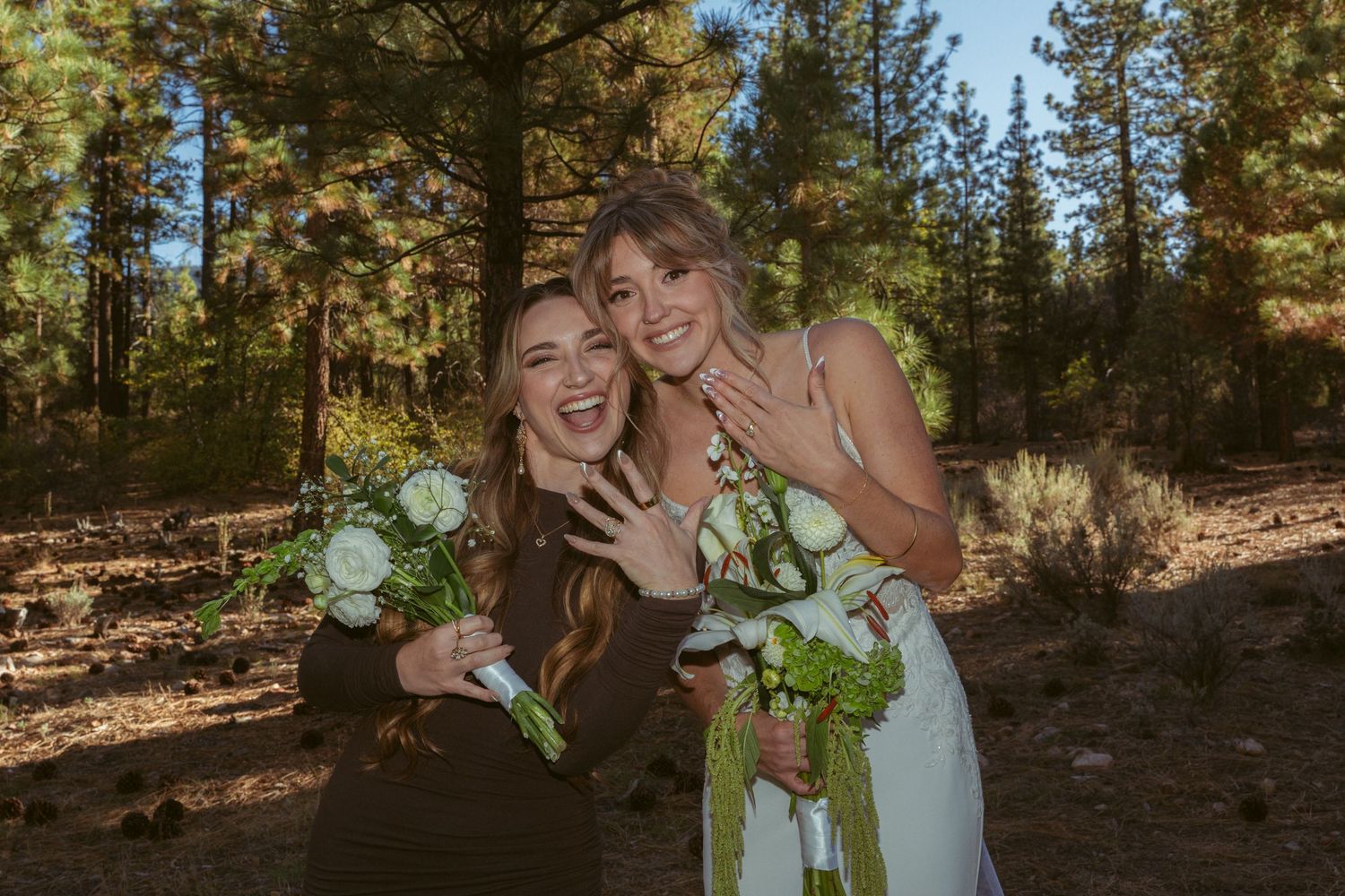 Candid wedding party moment captured in sunny forest setting.