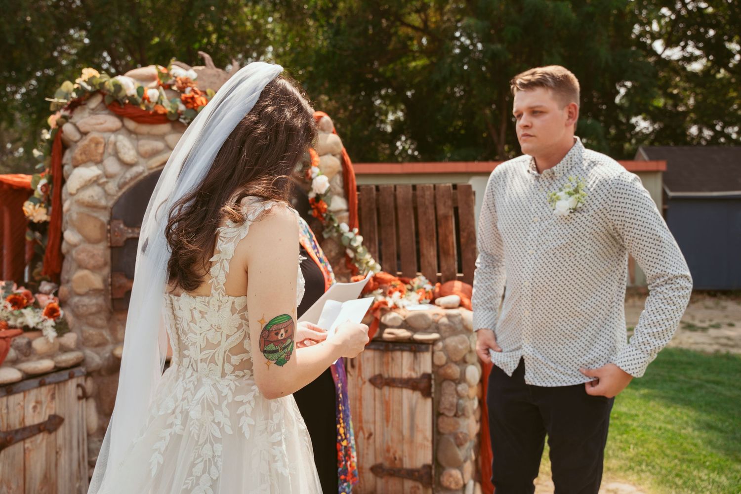 Couple sharing intimate moments during their wedding celebration outdoors.