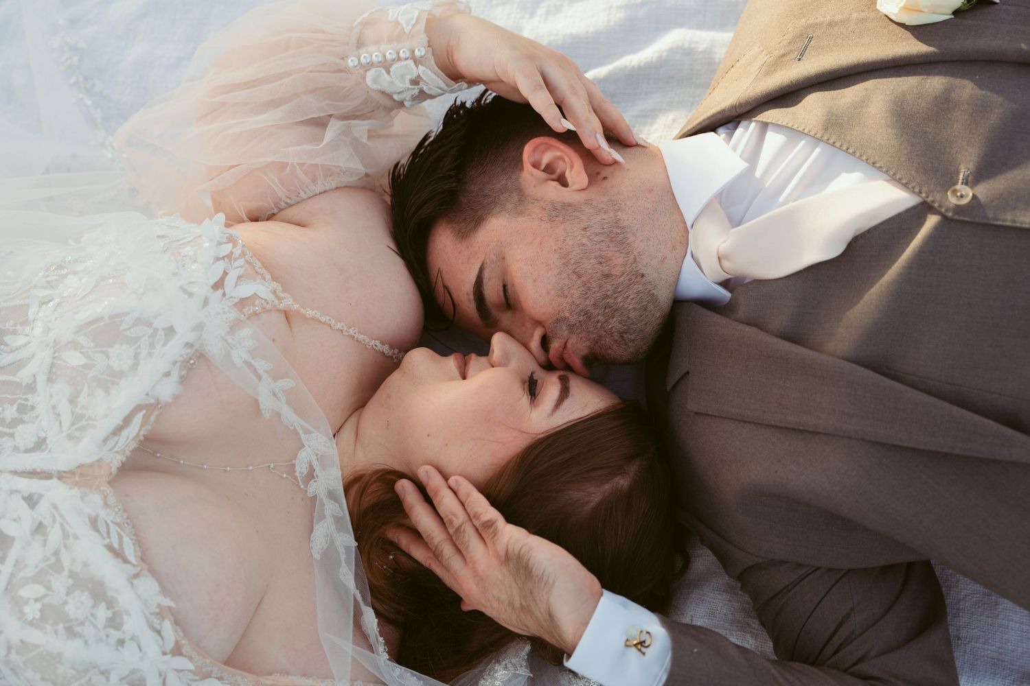 Close-up wedding portrait with delicate lace details against natural backdrop.