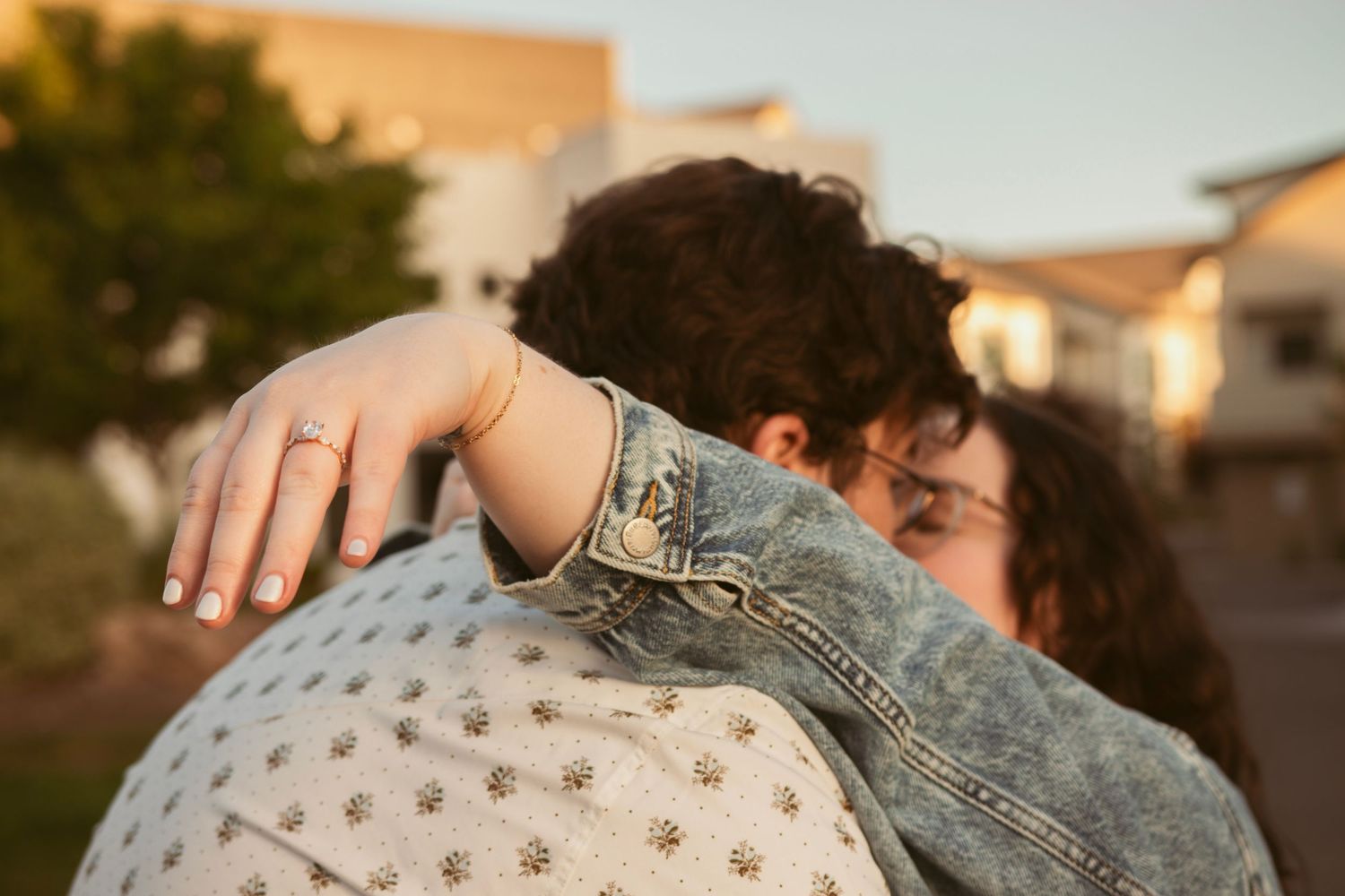 Close-up shot of hands during an emotional engagement moment.
