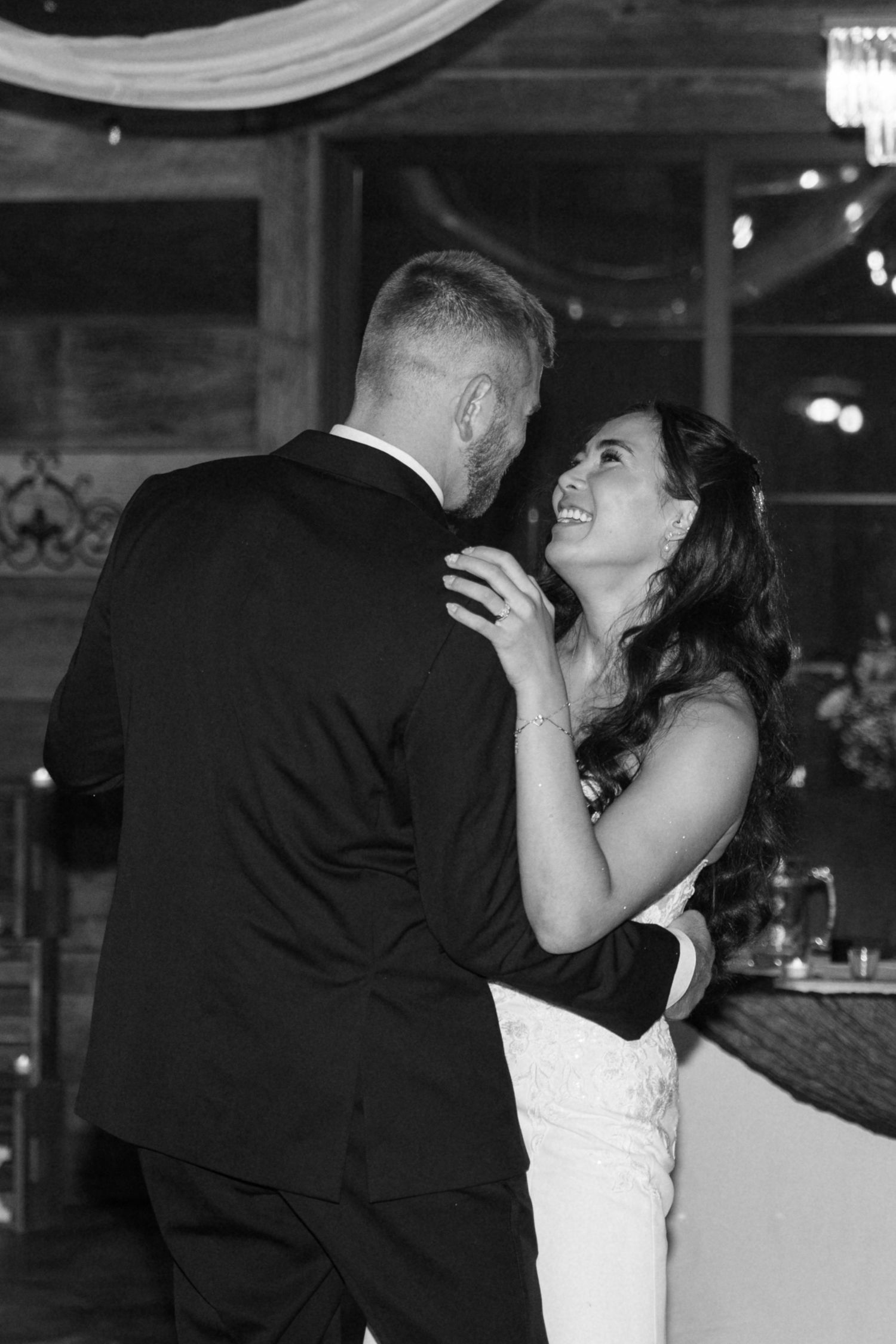 Couple shares a romantic dance moment during their wedding reception.