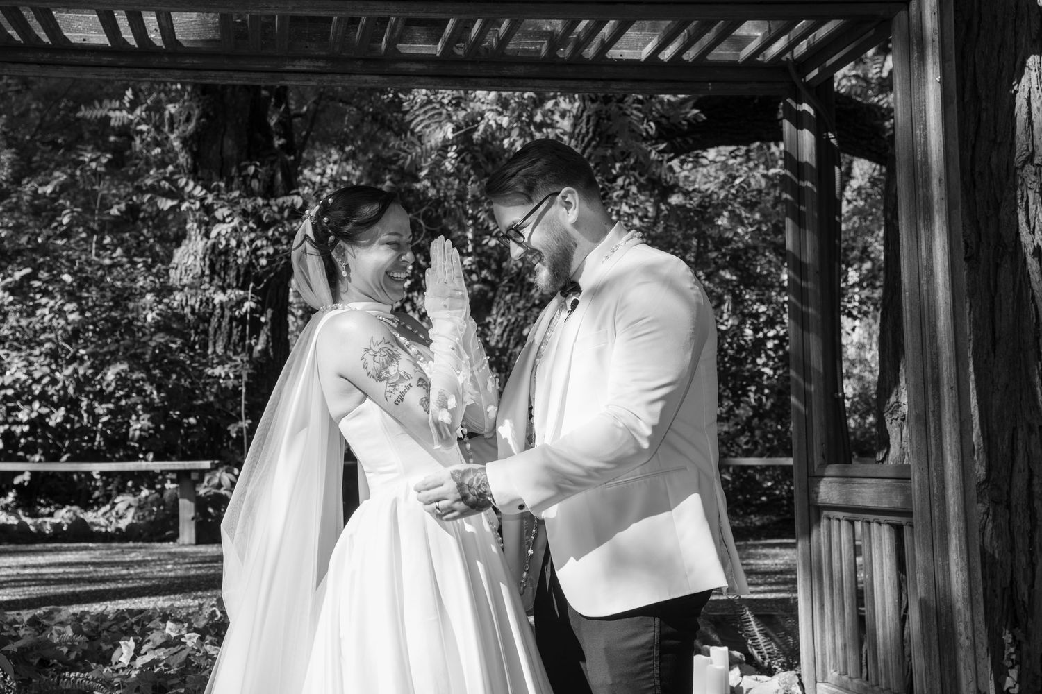 A couple shares intimate moments during their wedding day in a series of black and white photographs.