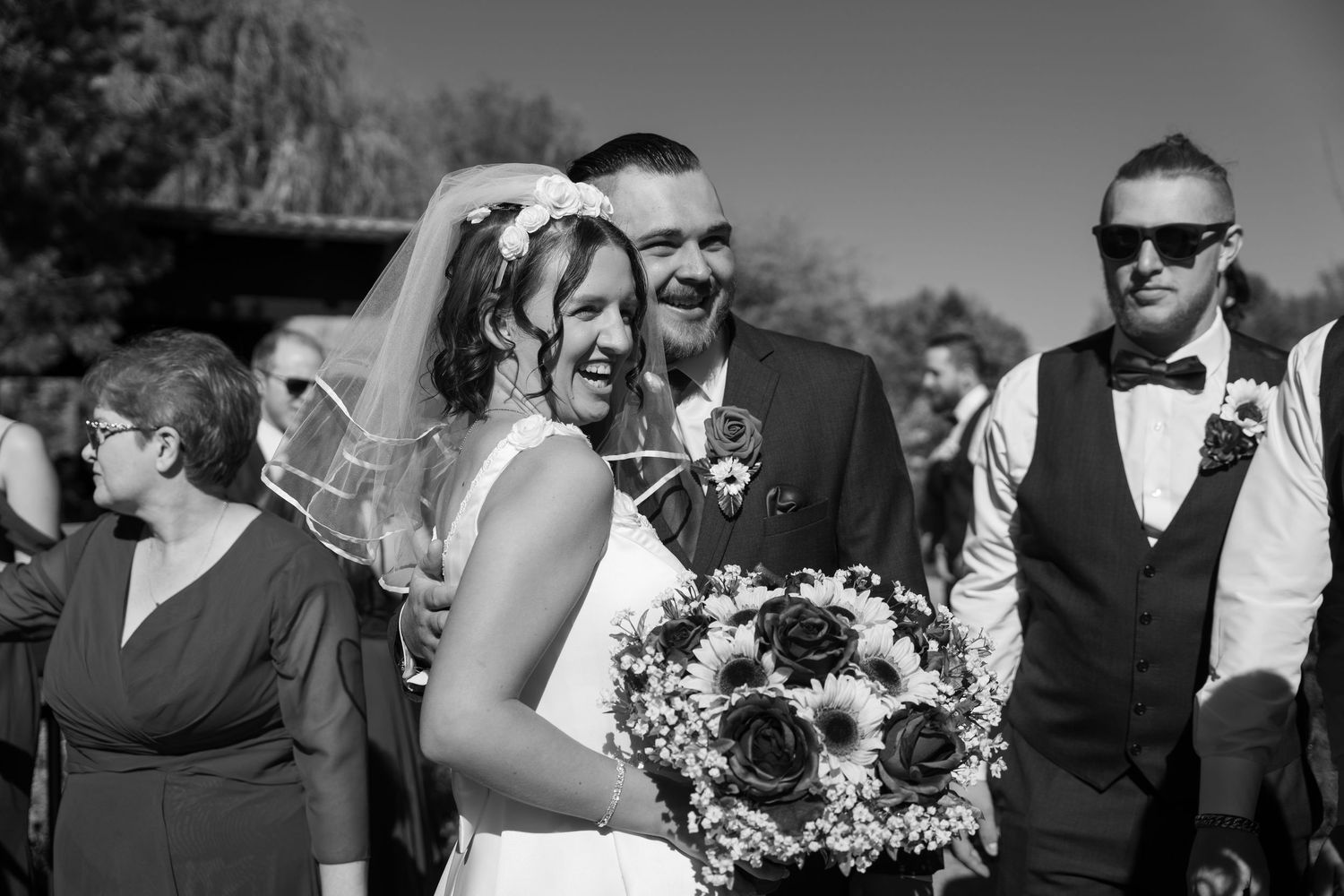 Black and white portrait series of wedding party members outdoors.