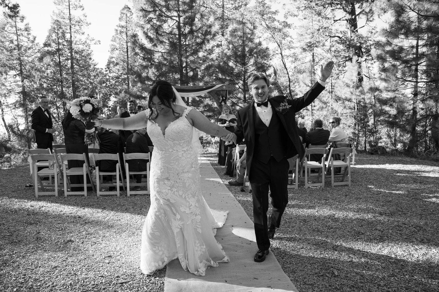 Black and white wedding ceremony photos showing couple and guests in forest setting.