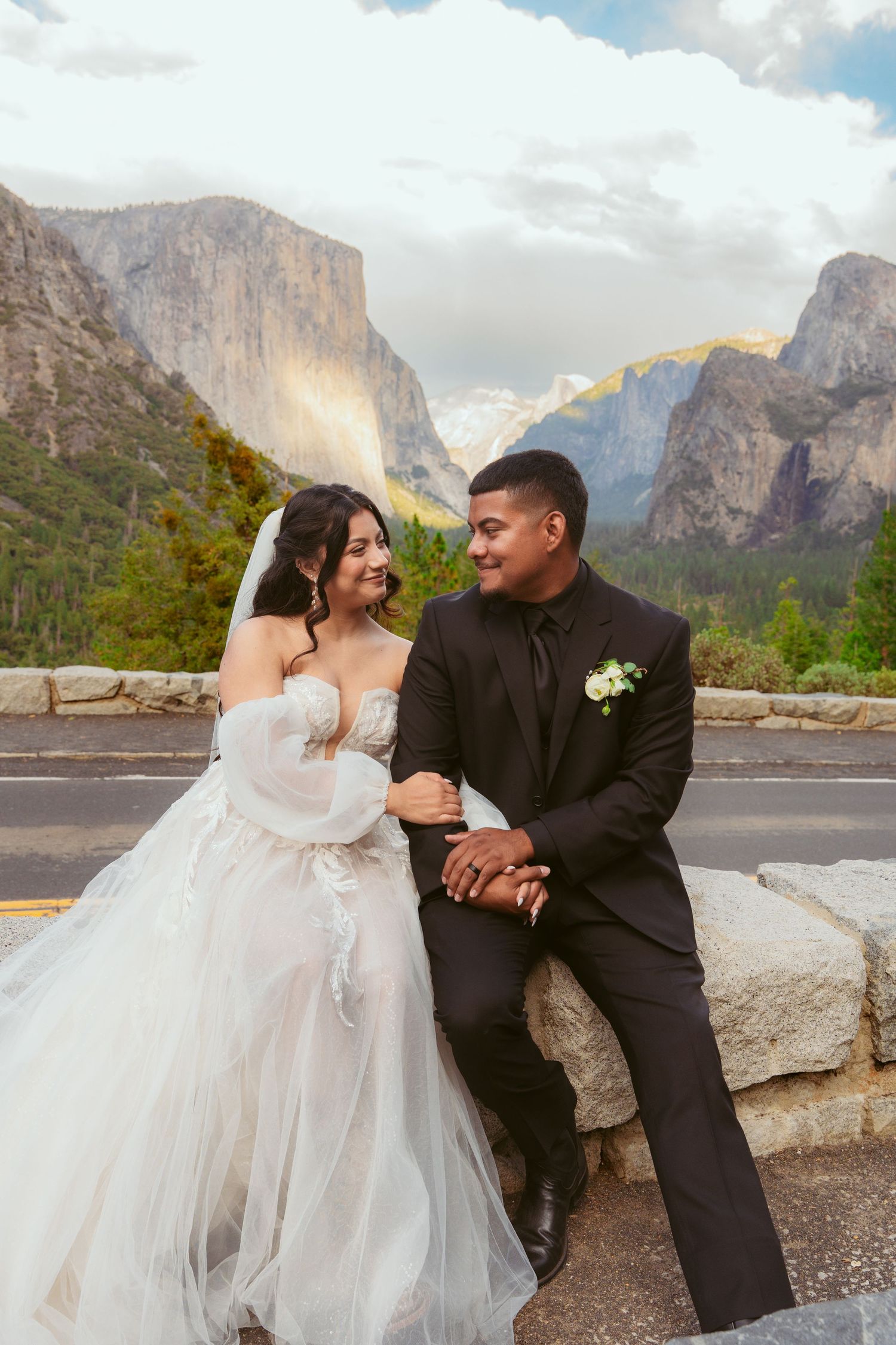 A romantic wedding photoshoot against the majestic backdrop of Yosemite Valley's iconic granite cliffs.