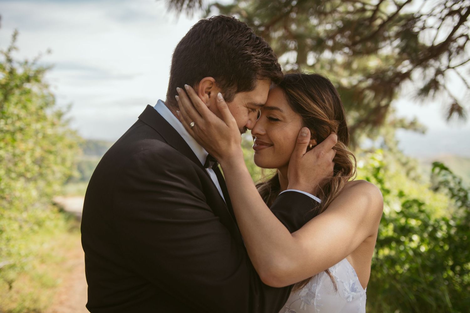 Romantic outdoor wedding moments captured against mountain scenery.