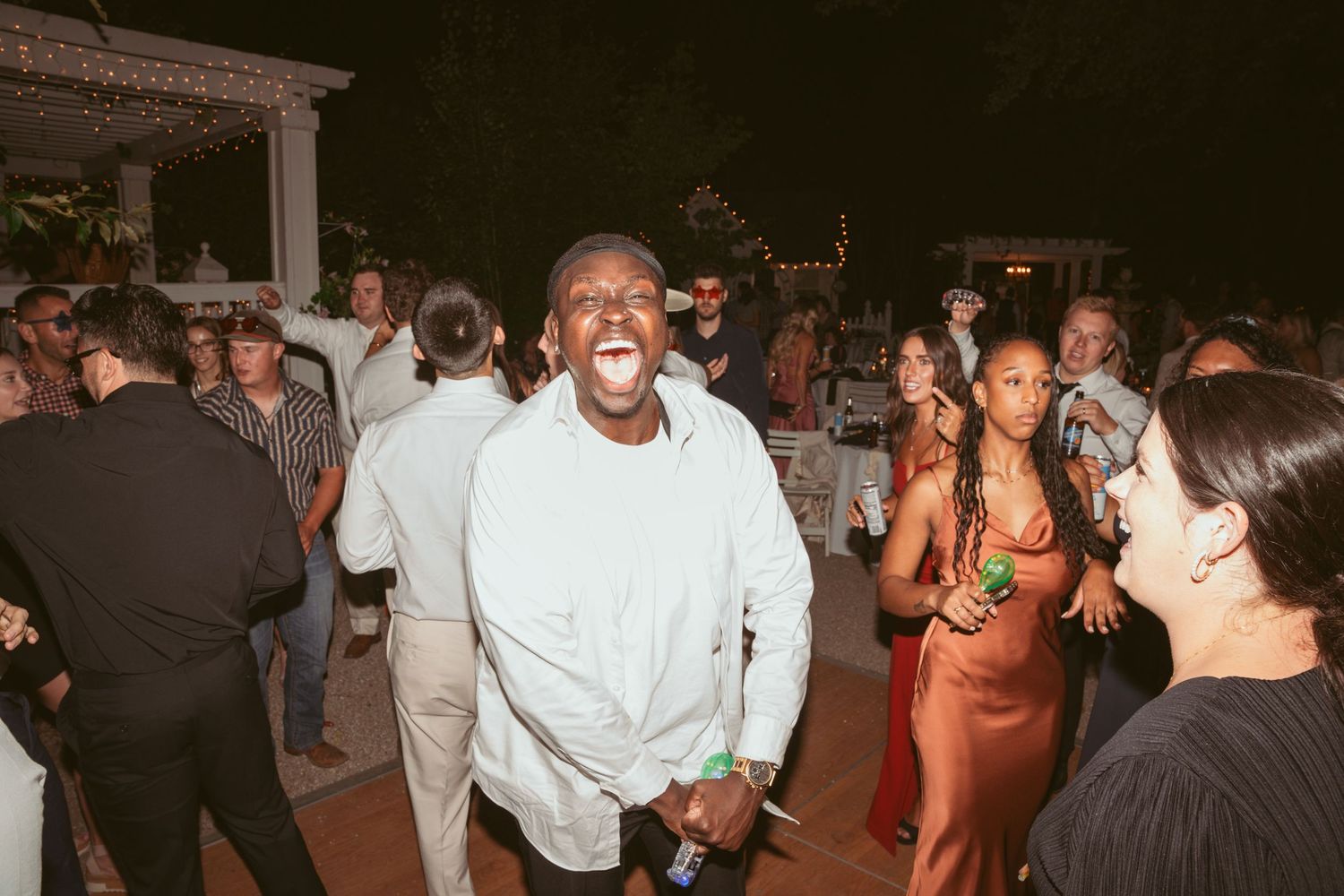 Lively dance floor scene with guests enjoying an evening celebration.