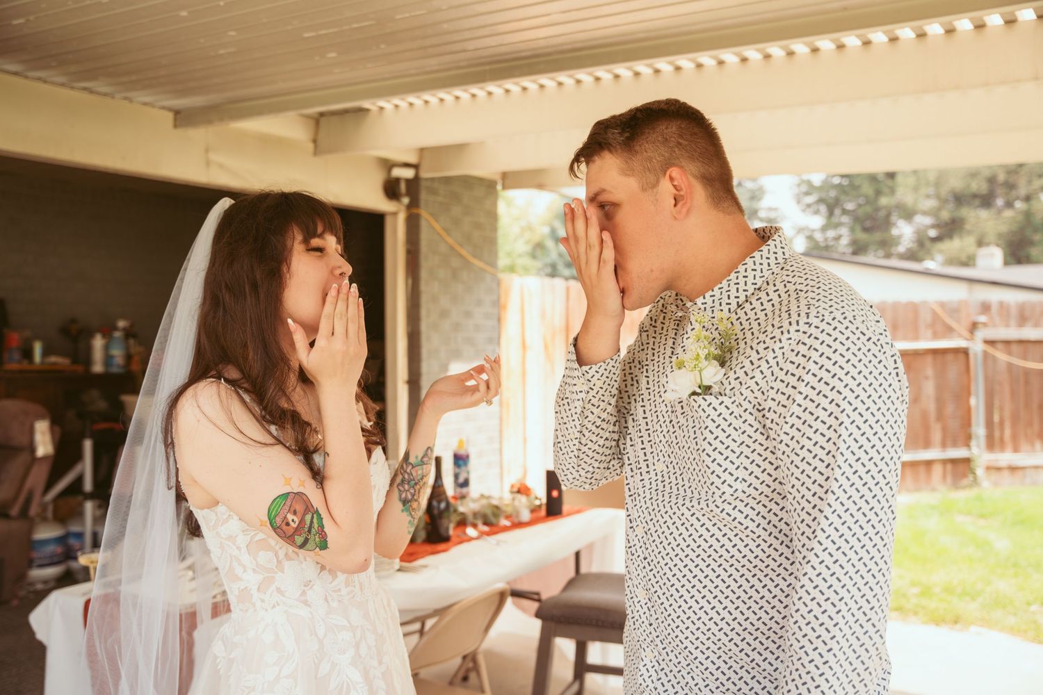 A romantic moment captured between a couple in a rustic indoor setting with natural lighting.