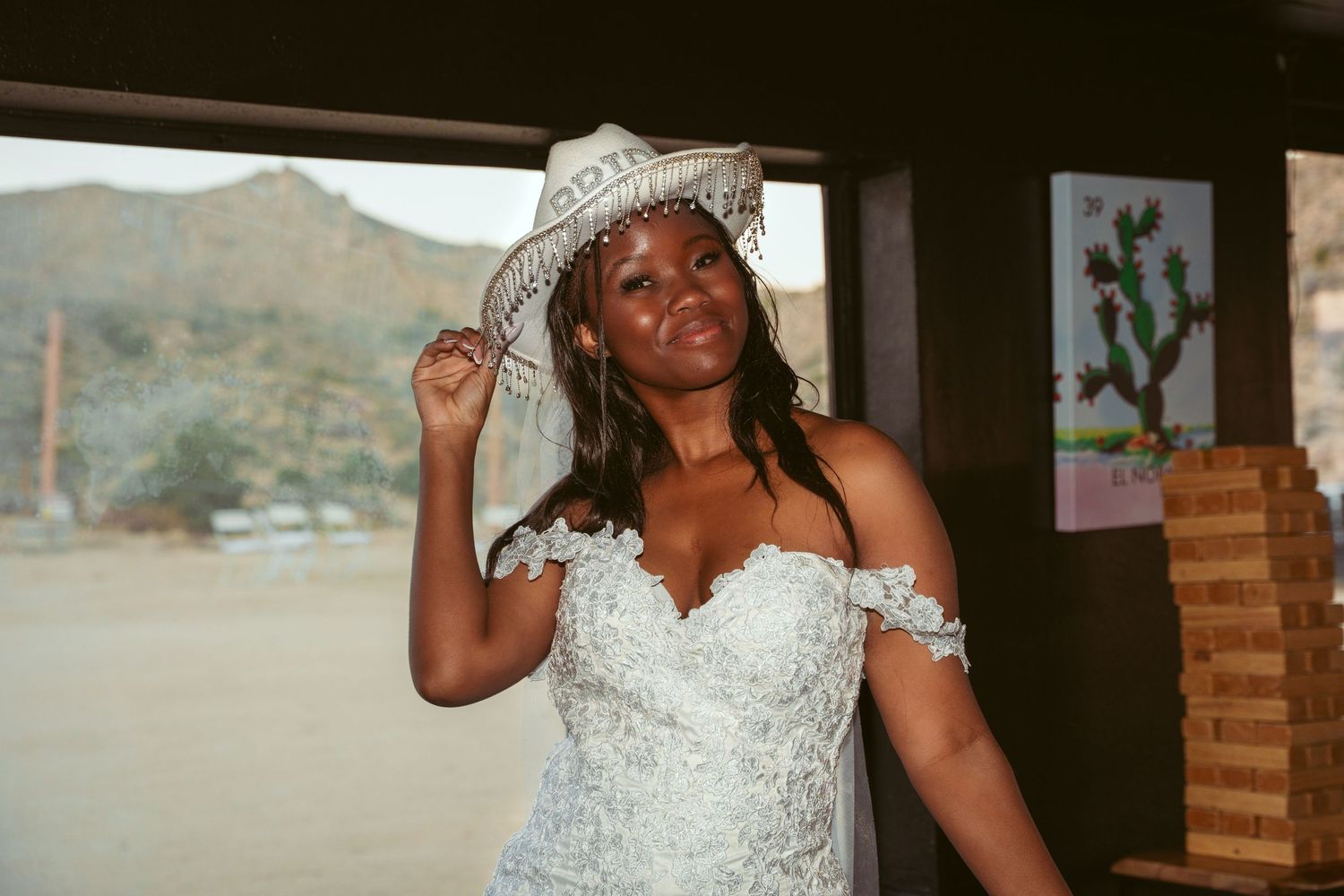 A bride in an elegant white dress poses during her wedding celebration.