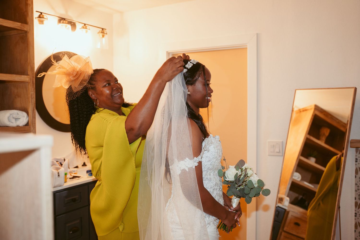 Candid moments captured during wedding preparations in a bright interior space.