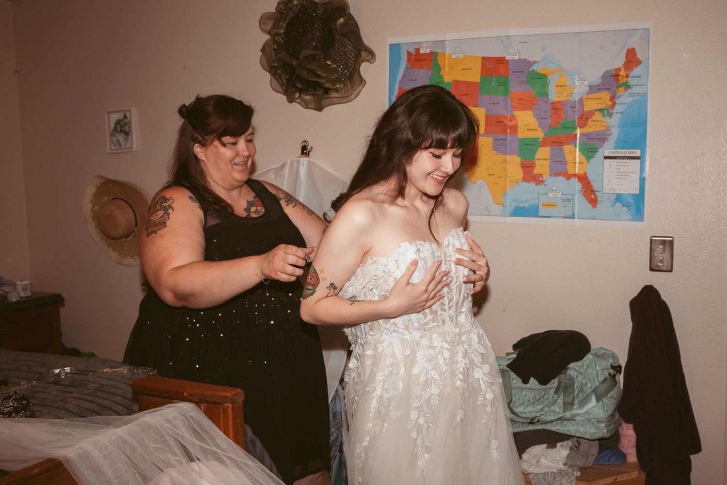 Indoor wedding preparation scene with a US map on the wall in the background.