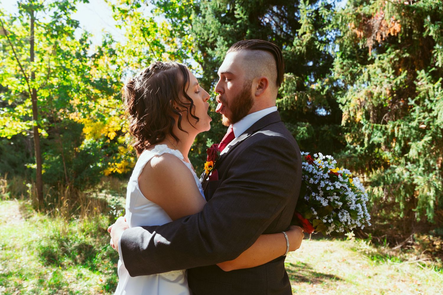 Candid wedding moments captured outdoors with natural sunlit greenery backdrop.