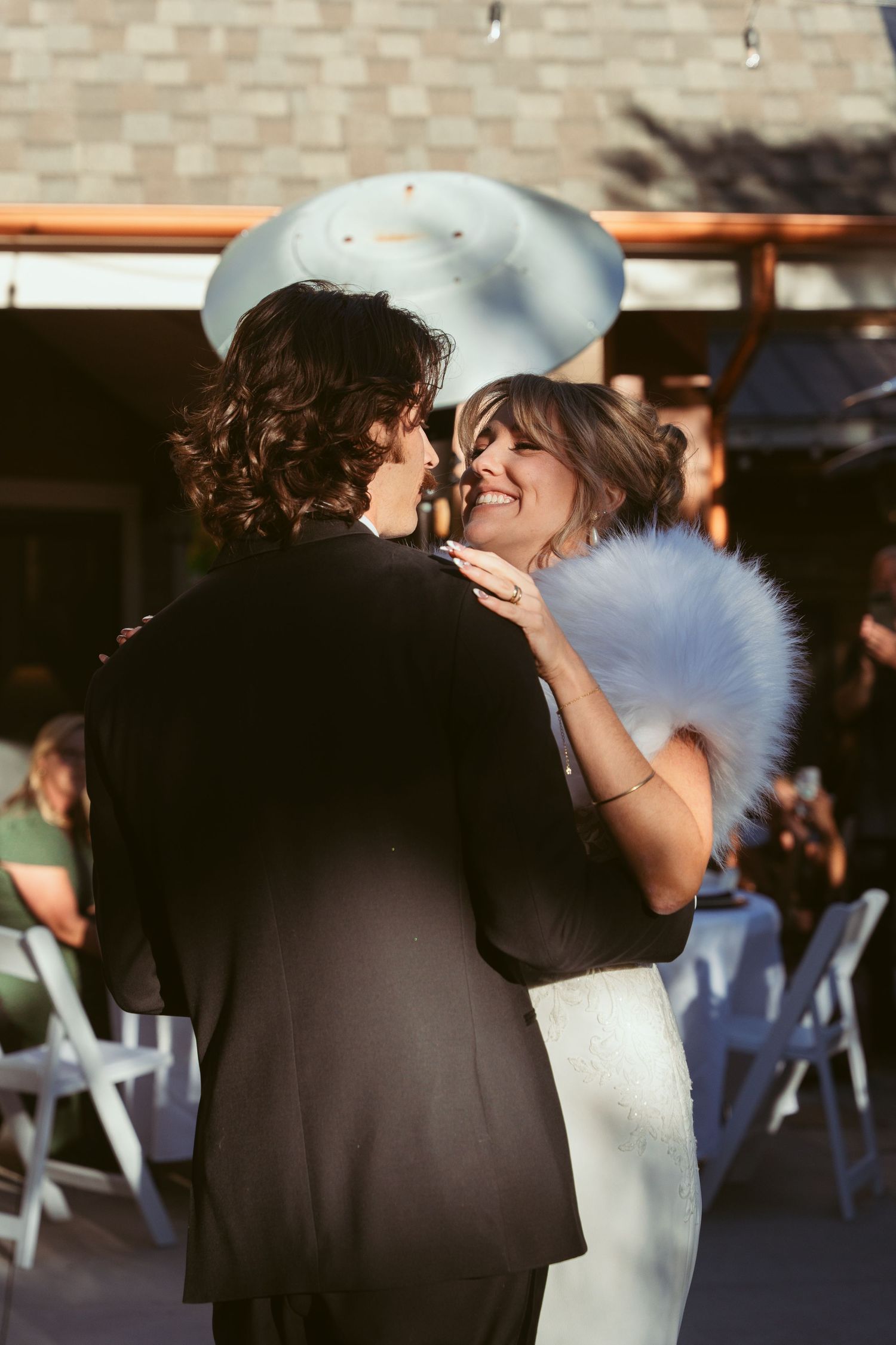 Romantic first dance moment between newlyweds at an elegant wedding reception.