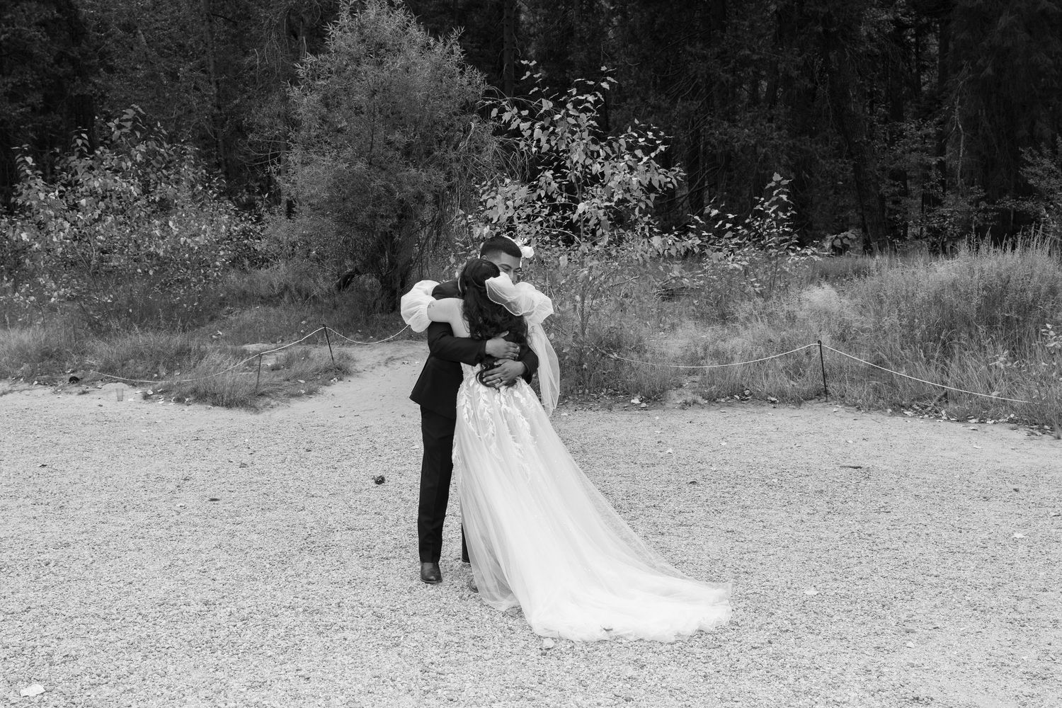 Black and white wedding portraits captured in natural outdoor setting.