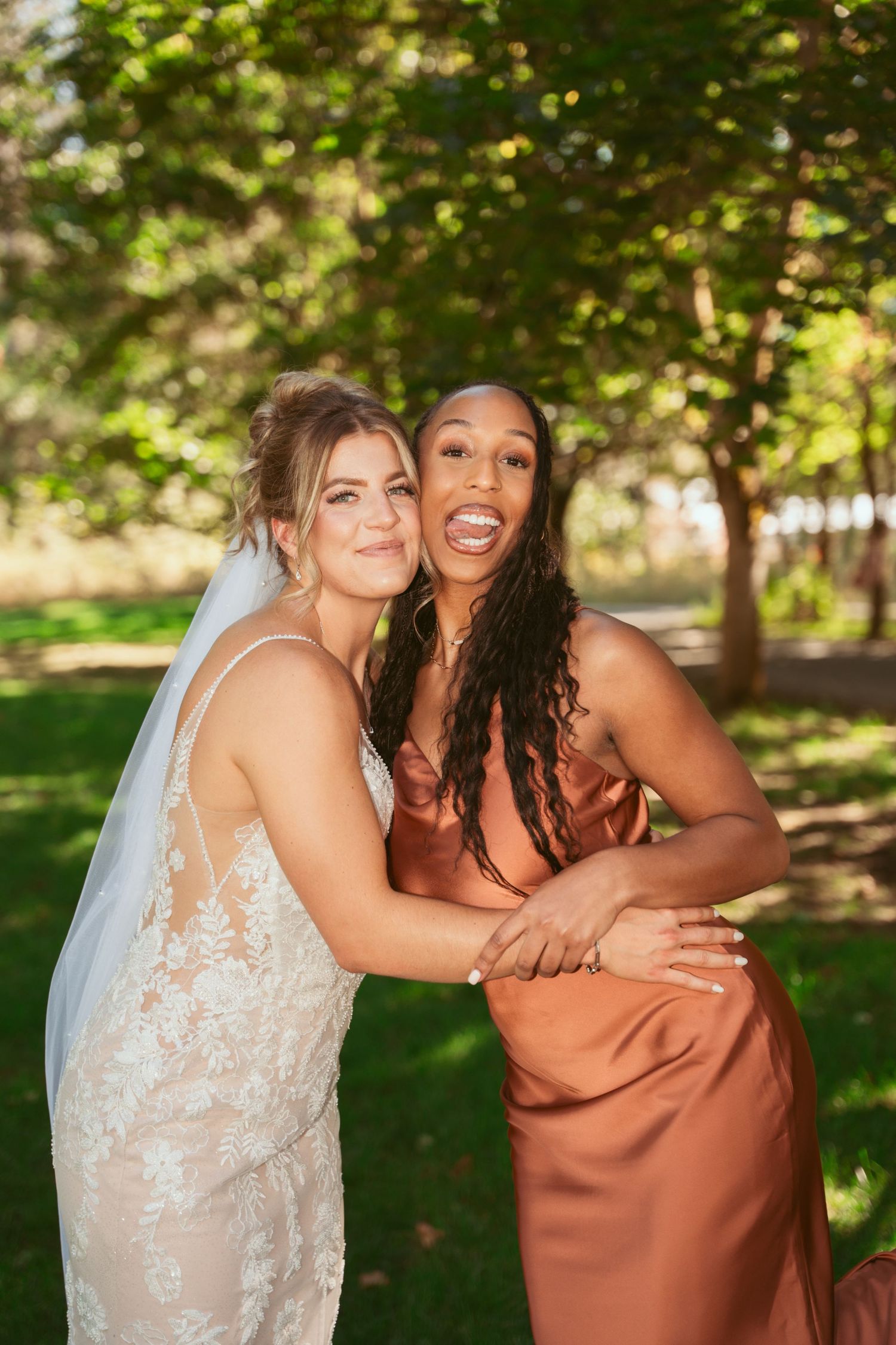 Candid photos show two people laughing and embracing in a sunny outdoor setting with trees in the background.