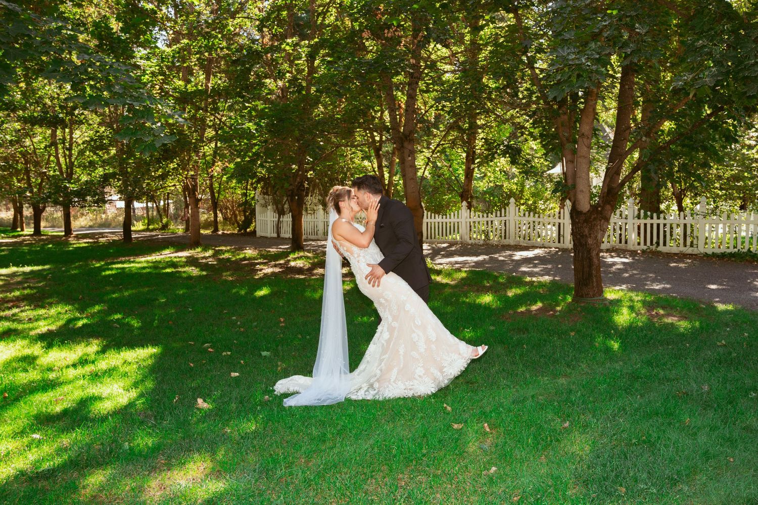 Elegant outdoor wedding photography session in a lush garden setting.
