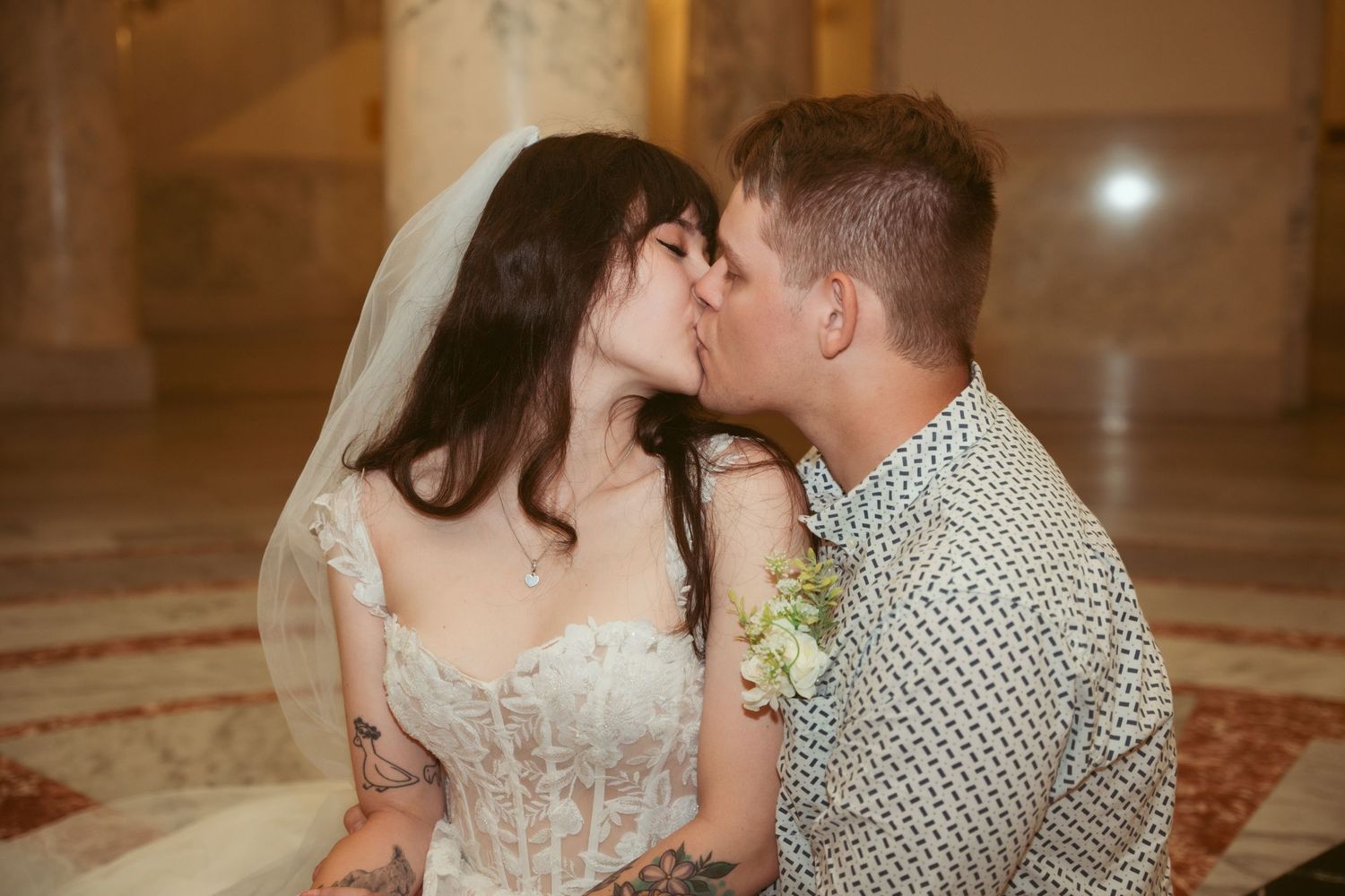 Romantic dance in an ornate ballroom with dramatic lighting and classical architecture.