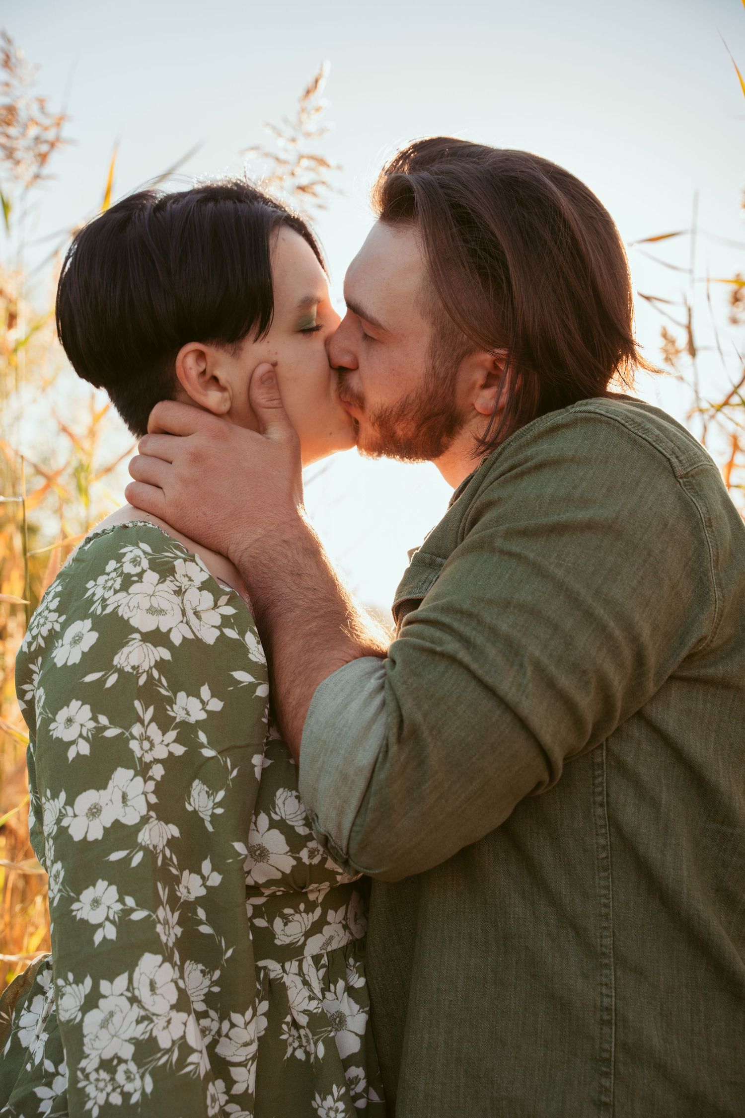 An intimate embrace captured in a series of romantic photos with golden sunlight.