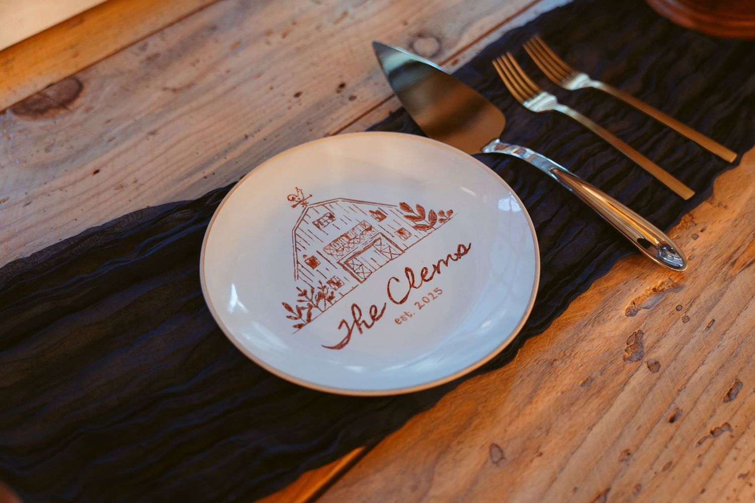 Custom printed plates and place settings on wooden table surface.