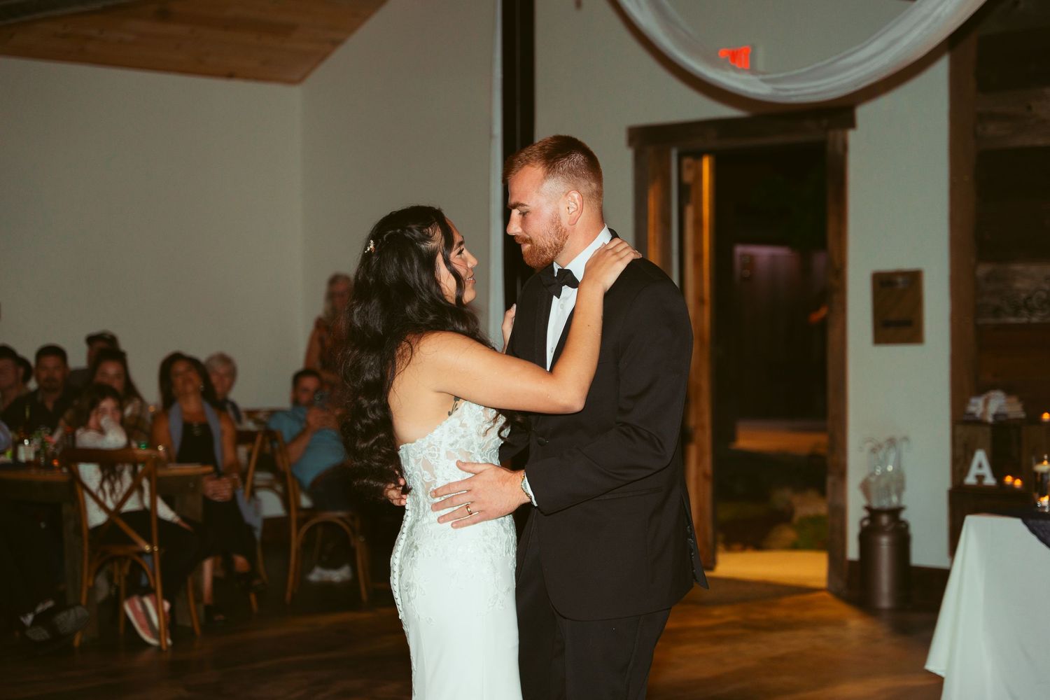 Couple sharing an intimate dance moment at their wedding reception.