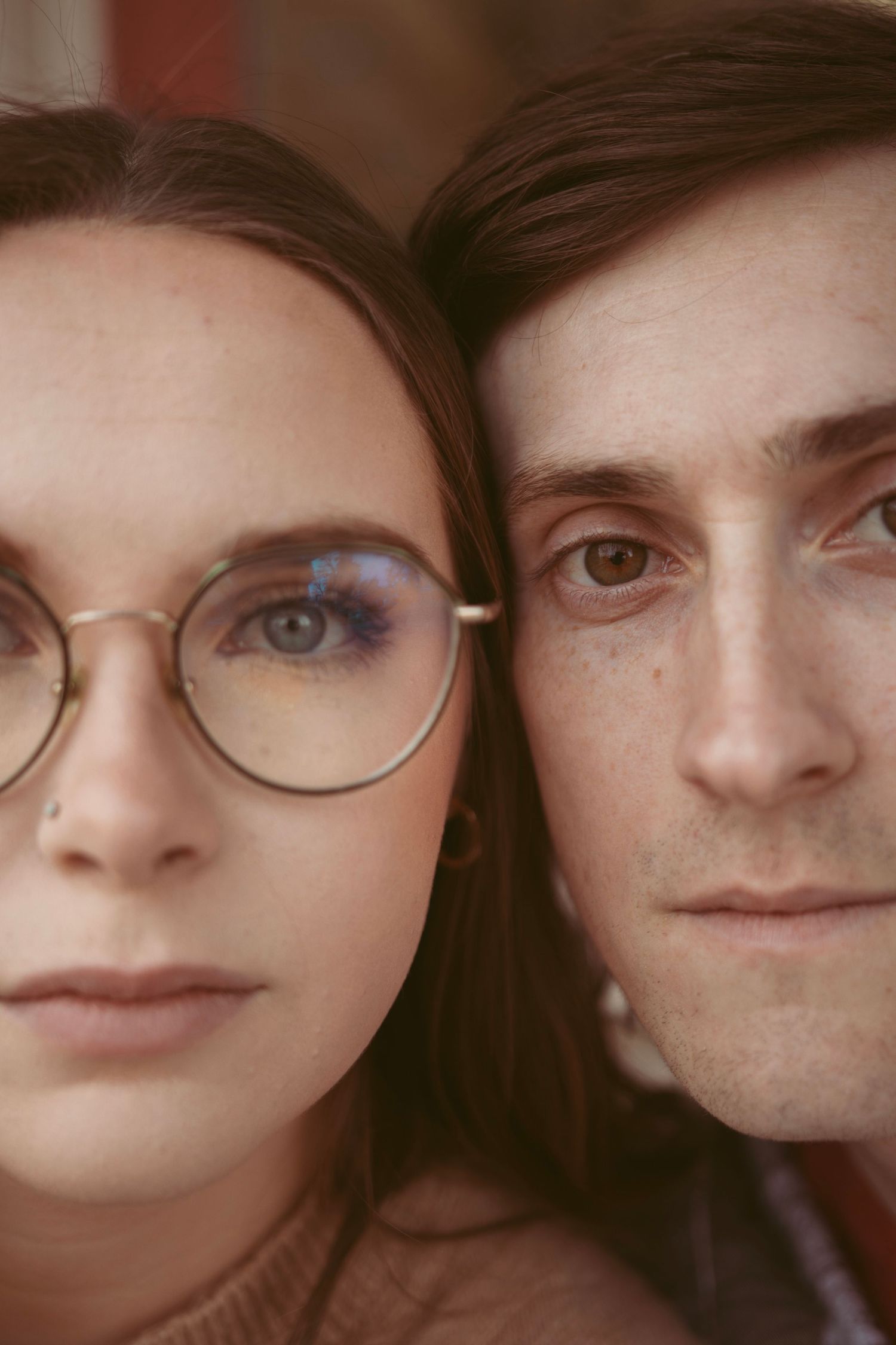 Close-up portrait showing eyes and faces in an intimate composition.