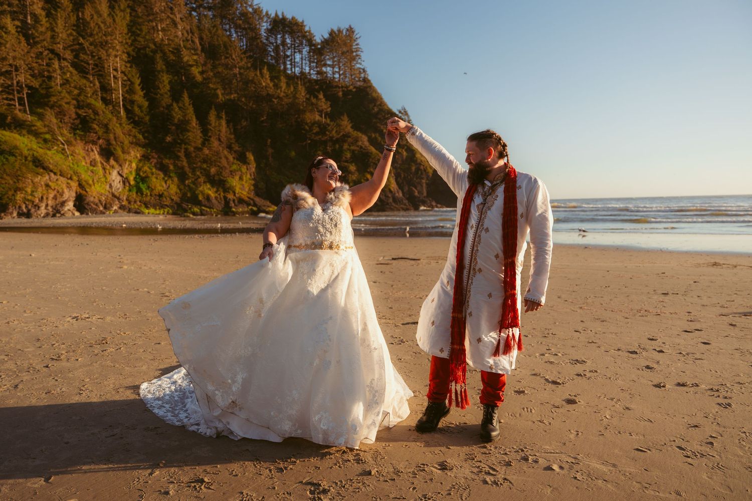 A romantic beach photoshoot with a white dress flowing in the wind against a coastal backdrop.