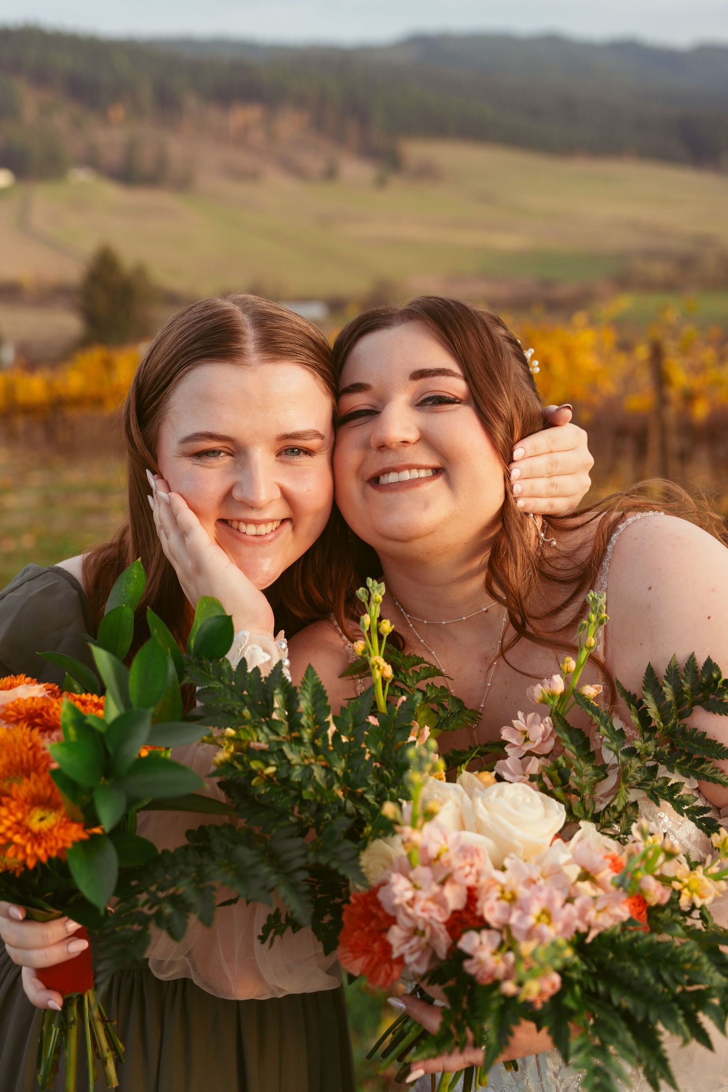 Close up portrait with autumn vineyard and rolling hills in background.