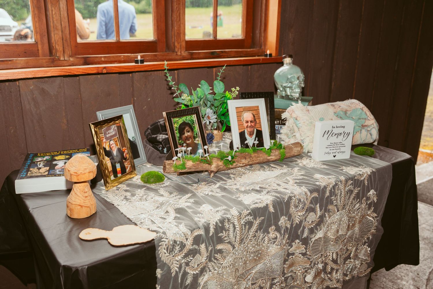 Reception area with decorative table settings and vintage-style decor in a wooden interior.