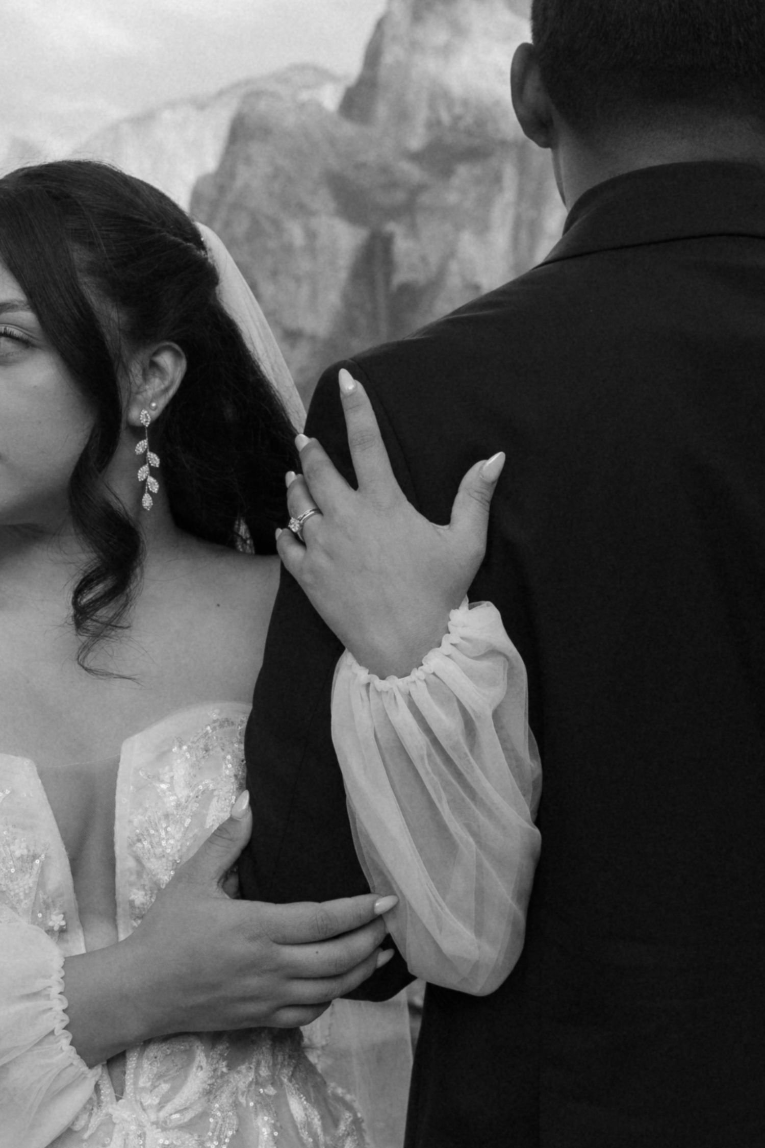 Intimate black and white wedding portraits showing tender moments between newlyweds.