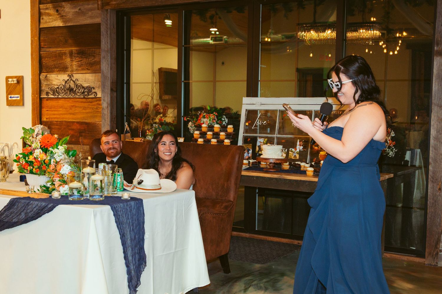 Wedding reception venue decorated with white linens and blue accents for an elegant celebration.