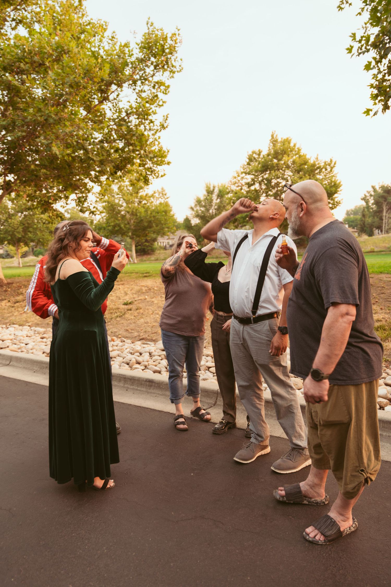 A group enjoying drinks together outside on an autumn evening.