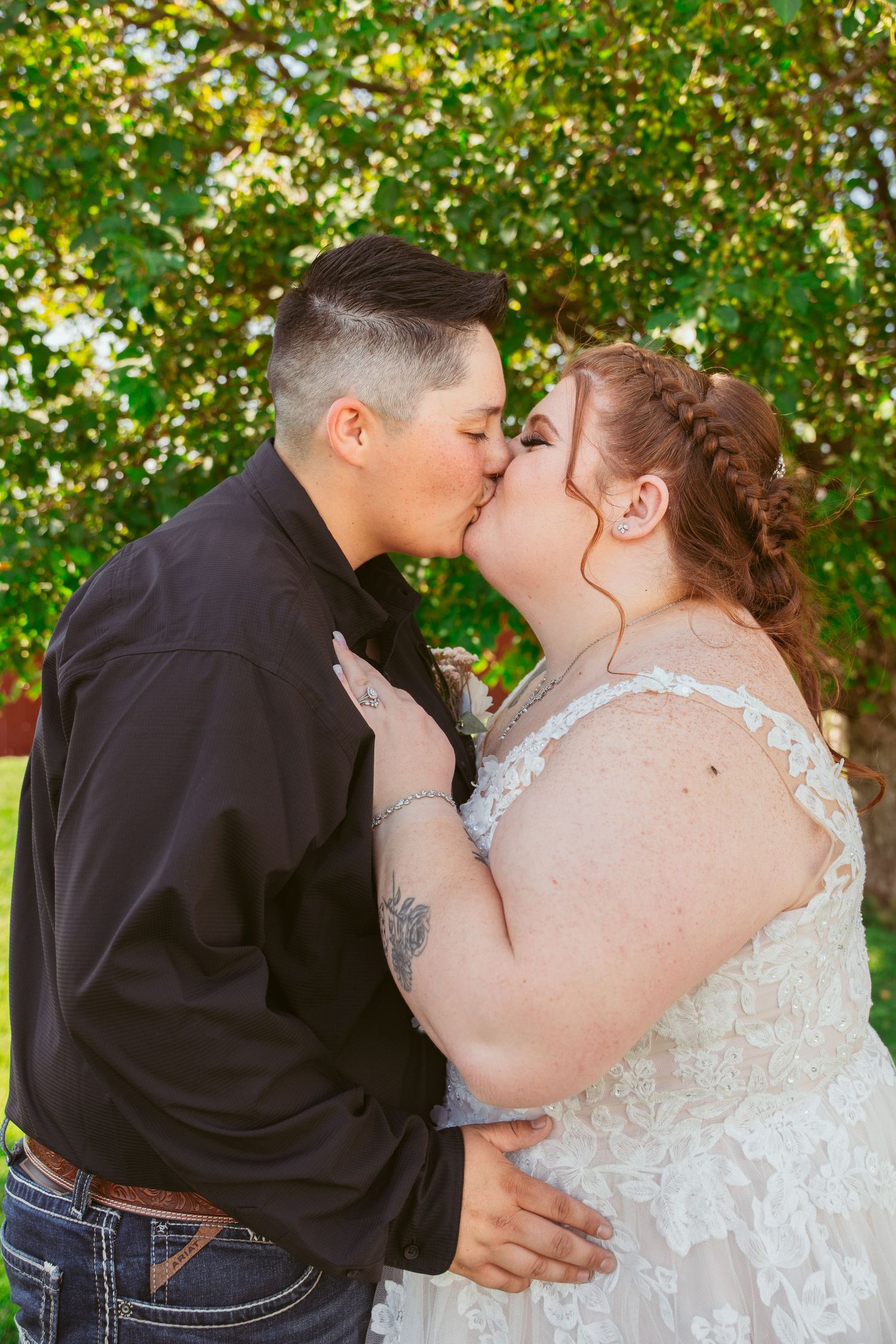 A romantic wedding kiss sequence outdoors with autumn foliage in the background.