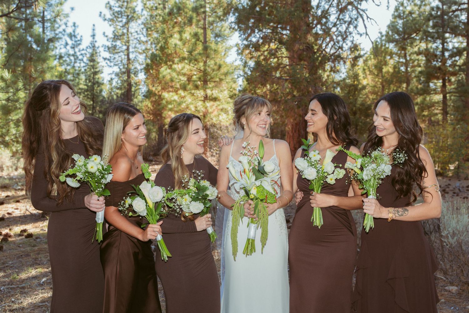 Candid moments of bridal party laughing and posing with bouquets in outdoor forest setting.