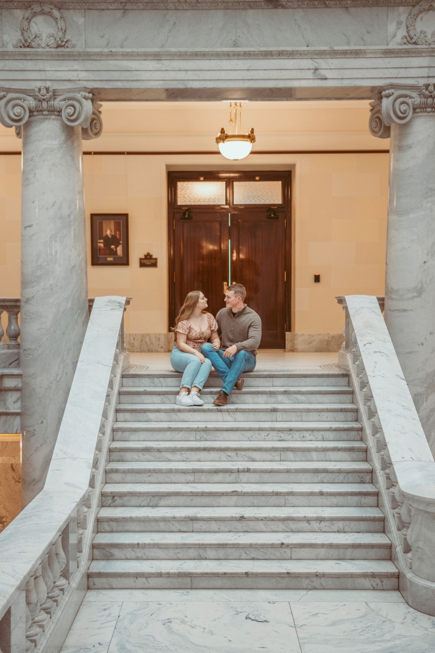 Marble staircase with classical architectural details in a government building.