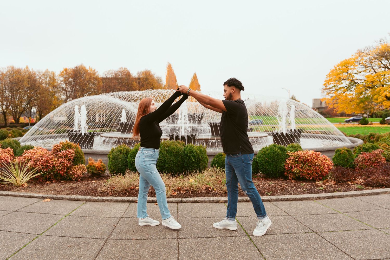 Playful dance moves captured in a series of shots against an autumn landscape.