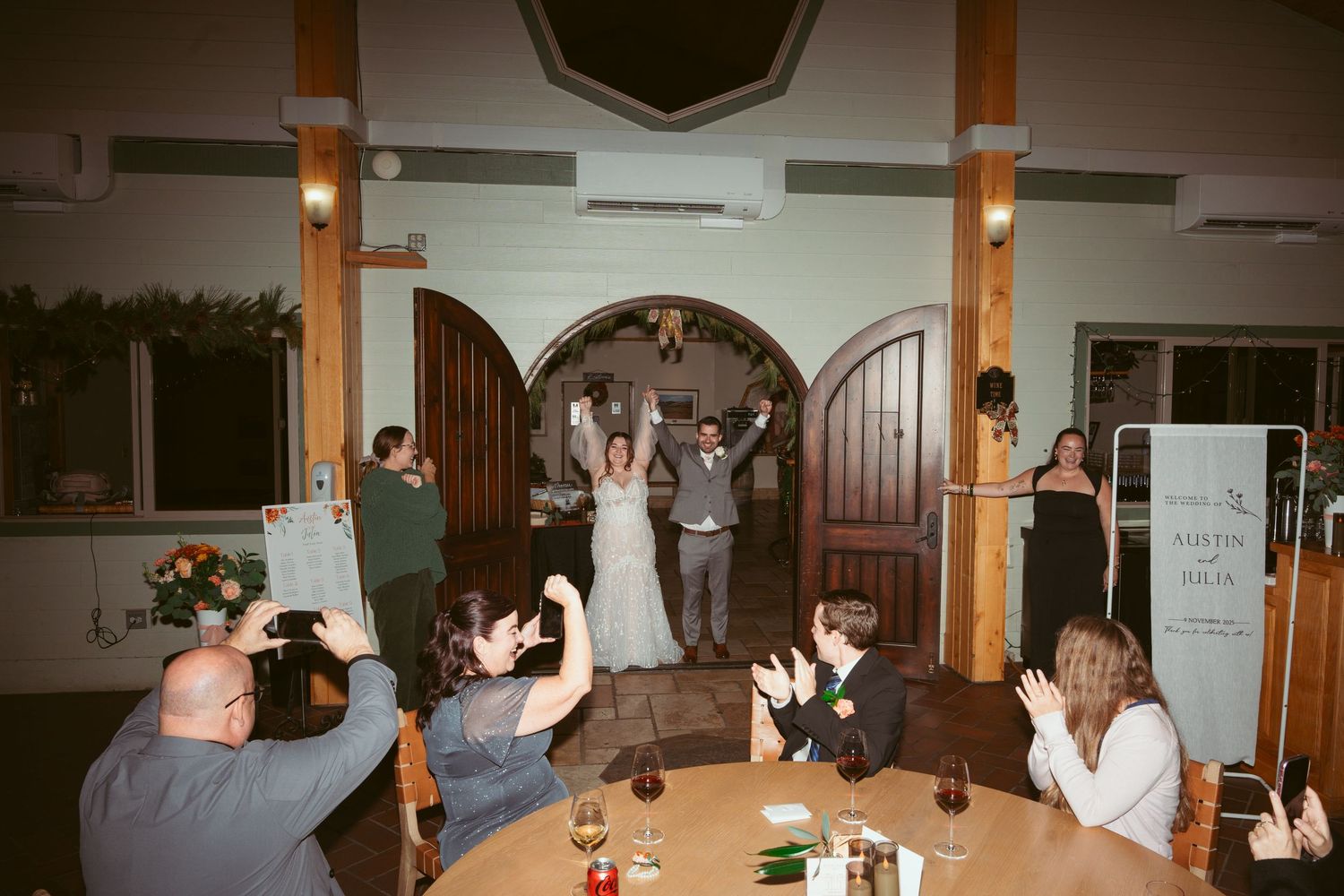 Wedding reception venue with wooden beams and arched doorways.