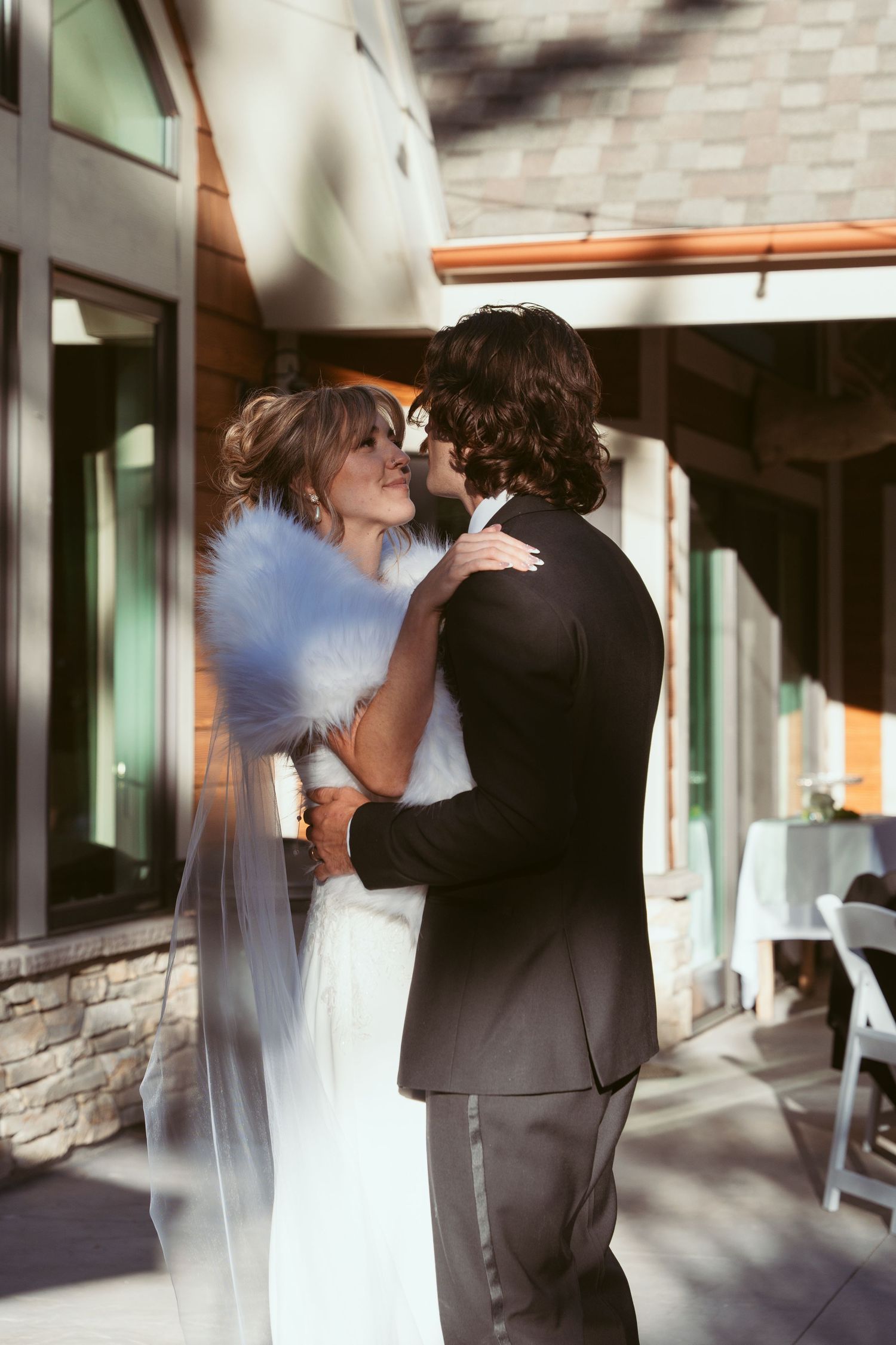 Indoor wedding venue photos showing intimate moments between newlyweds.