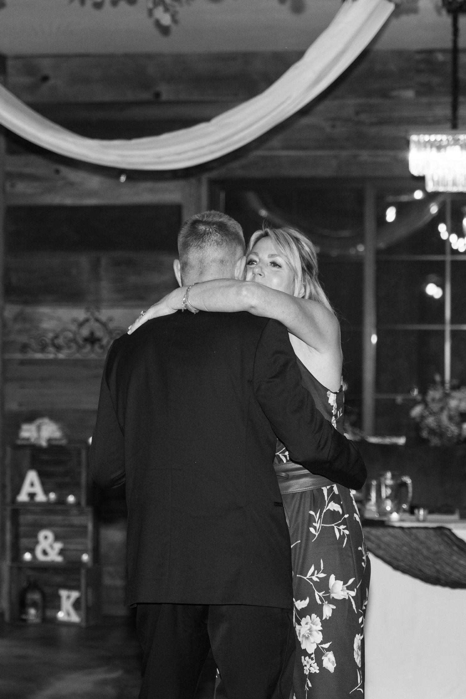 Couple dancing in an intimate moment at their wedding reception.