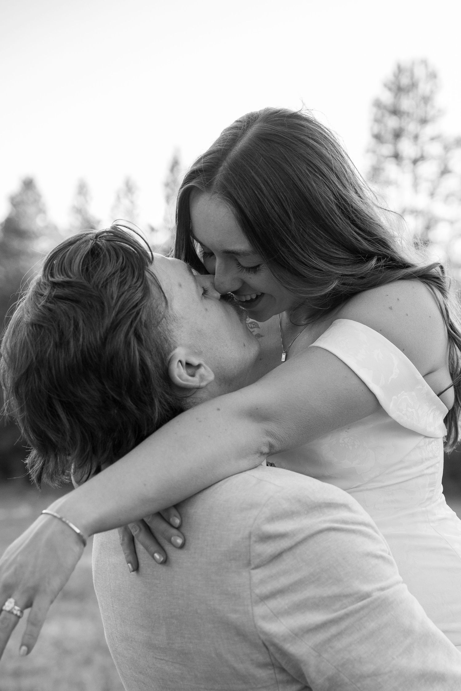 Intimate black and white portrait sequence capturing a loving moment between a couple.