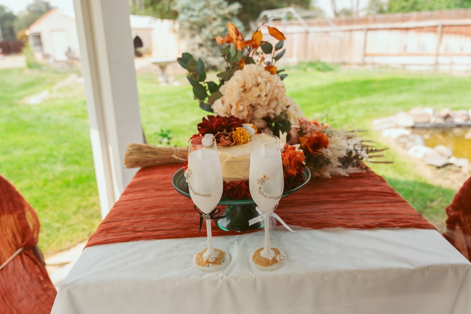 Elegant table settings with floral centerpieces and rustic decor for a wedding reception.