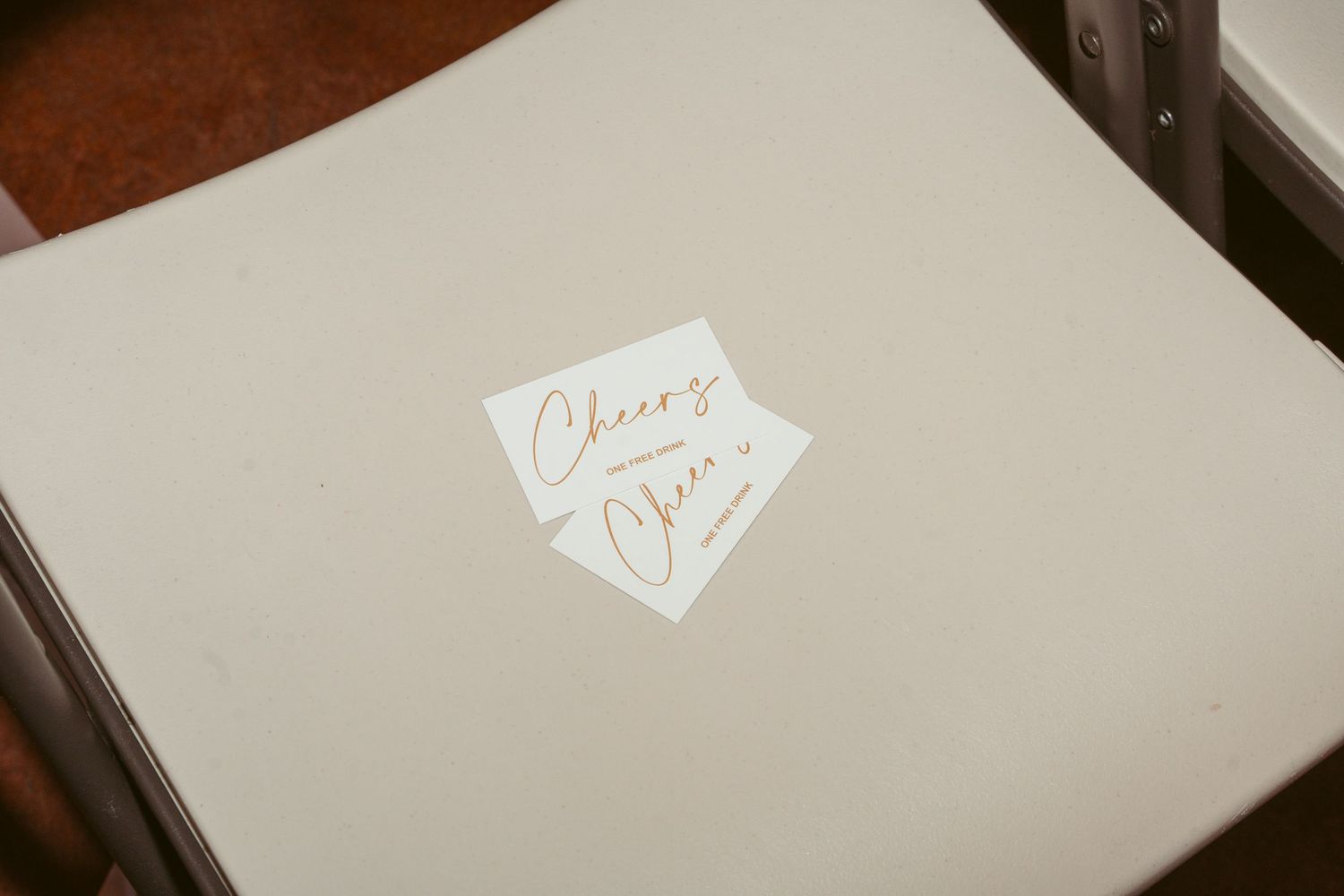 White wedding album or guestbook with elegant gold text on cover.