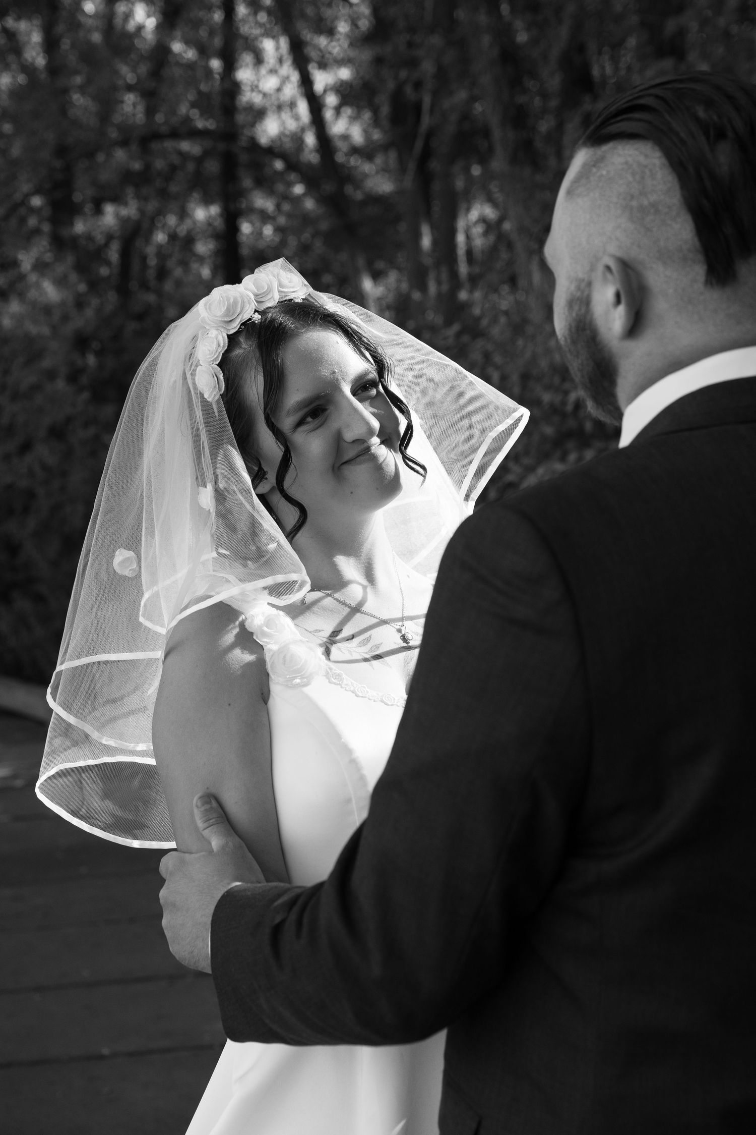 Black and white series of tender moments between newlyweds during first dance.