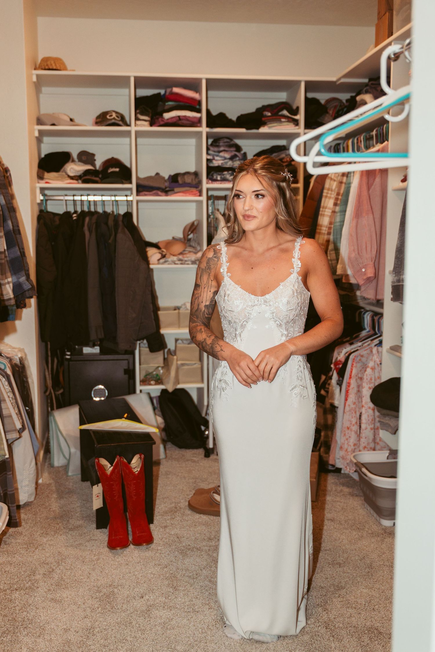 A spacious walk-in closet with organized clothing racks and shelving units.