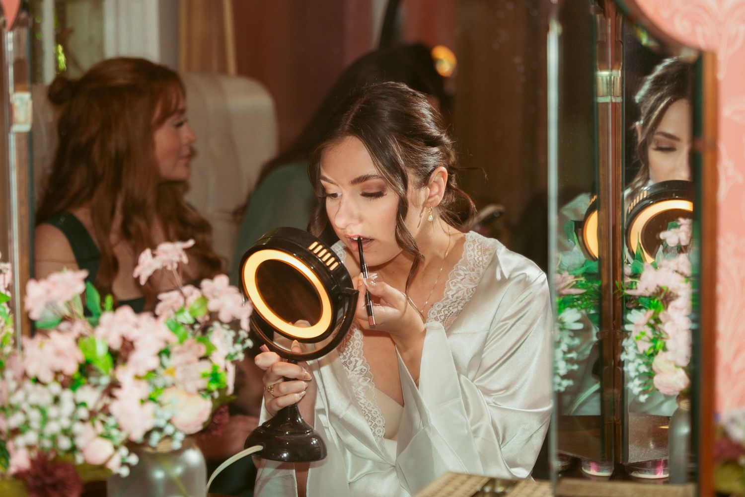 Candid moments captured during wedding preparations in an elegant setting.